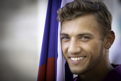 Close-up portrait of a smiling young man