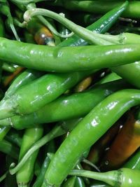 Full frame shot of green chili peppers at market