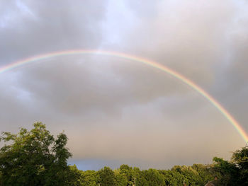 Low angle view of rainbow against sky