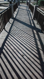 High angle view of empty benches on footpath