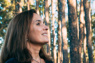 Portrait of adult woman smiling outdoors