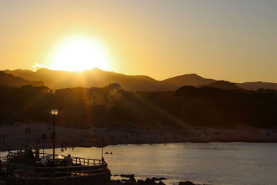 Scenic view of silhouette mountains against sky during sunset