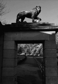 Low angle view of horse statue against sky