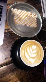 High angle view of coffee cup on table