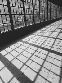 Shadow of railing on footpath