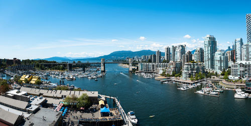 High angle view of bay and buildings against sky