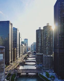 Buildings in city at sunset