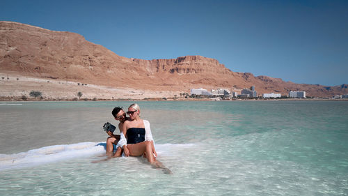 Aerial image of couple on a dead sea beach at israel