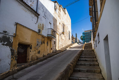 Narrow alley amidst buildings in city