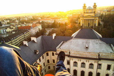 Silhouette of man in front of church