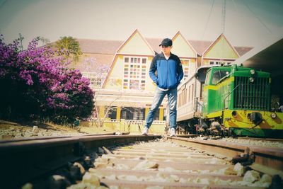Full length of man standing with umbrella