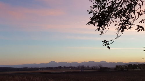 Scenic view of landscape against sky during sunset