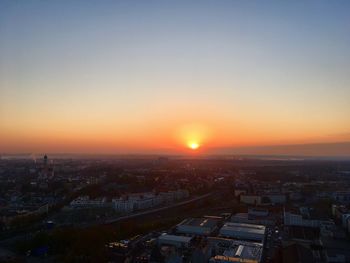 High angle view of buildings against sky during sunset