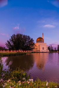 Masjid as-salam by lake at sunset