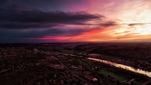 High angle view of city against sky during sunset