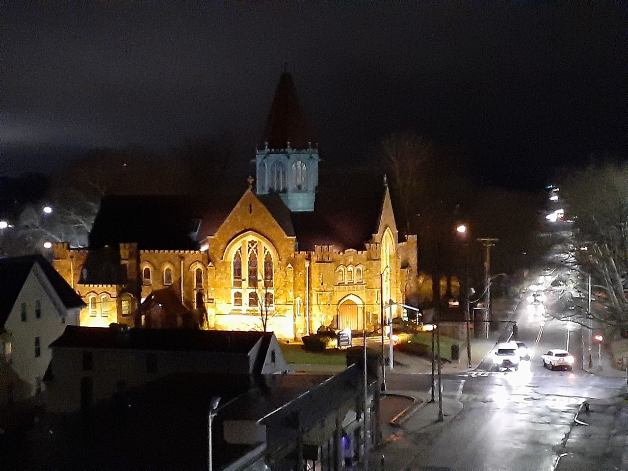 ILLUMINATED BUILDINGS BY STREET AGAINST SKY AT NIGHT IN CITY