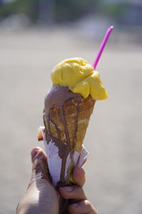 Person holding ice cream cone