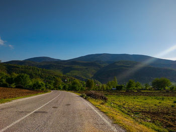 Road leading towards mountains