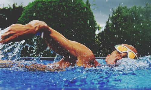 Athlete swimming in pool