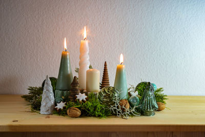 Close-up of christmas decorations on table at home