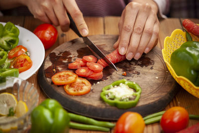 Man preparing food on cutting board