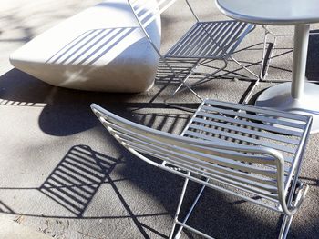 High angle view of empty chairs on table
