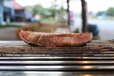 Close-up of meat on barbecue grill