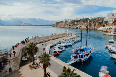 Boats moored at harbor