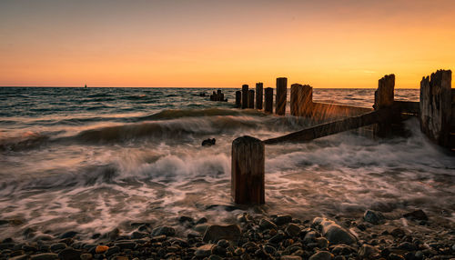 Scenic view of sea against sky during sunset