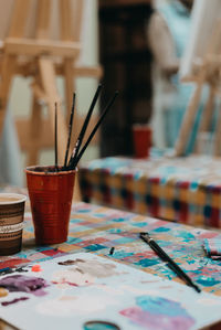 Close-up of paintbrushes on table