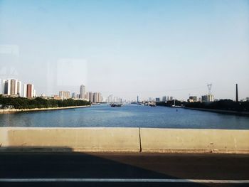 City by buildings against clear sky