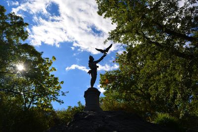 Low angle view of statue against sky