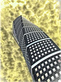 Low angle view of modern building against cloudy sky