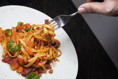 Close-up of person preparing food on table