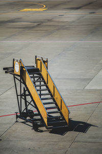 High angle view of airplane on airport runway