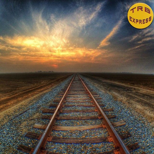 transportation, the way forward, sky, diminishing perspective, vanishing point, railroad track, sunset, cloud - sky, rail transportation, orange color, yellow, no people, cloud, outdoors, cloudy, tranquility, tranquil scene, travel, straight, landscape