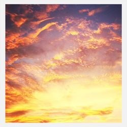 Low angle view of cloudy sky at sunset