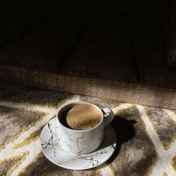 High angle view of coffee cup on table