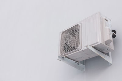Close-up of electric lamp against white background