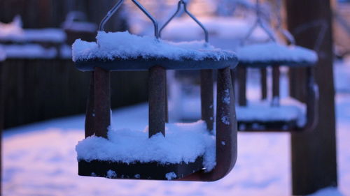 Close-up of snow on swing