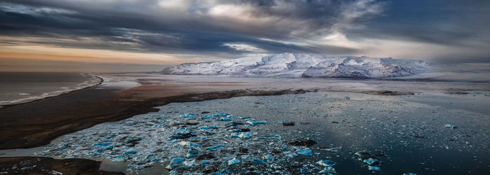 Scenic view of sea against sky during winter