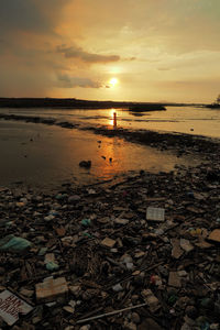 Scenic view of sea at sunset