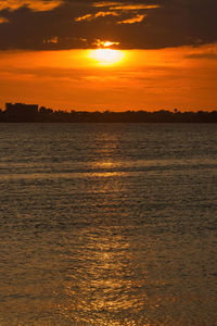 Scenic view of sea against romantic sky at sunset