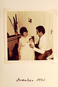 Father and son sitting on table