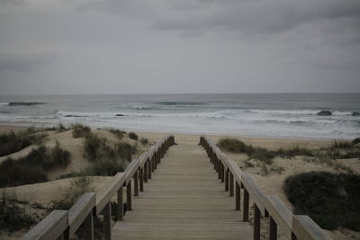 Pier over sea against sky