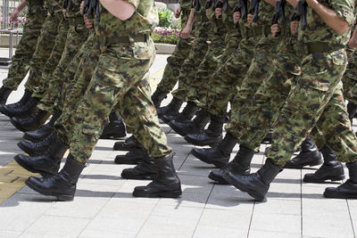 Low section of soldiers marching on street