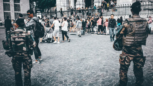 People walking on street in city