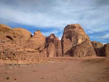 Panoramic view of arid landscape against sky