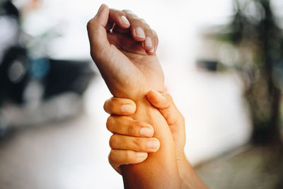 Close-up of hand holding hands