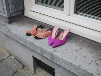 Low section of woman standing on footpath